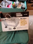 New Central Pneumatic Mini Air Compressor With Brush & Hose 95630. Fixed Price $79.99.