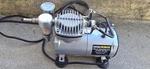 Central Pneumatic Mini Air Compressor With Brush And Hose Model # 95630. Fixed Price $55.00.